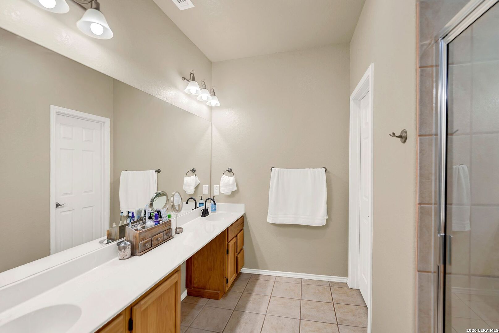 445 Spanish Grant Circle Bandera, TX 78003 - Photo 34 of 47 a bathroom with a sink and a mirror