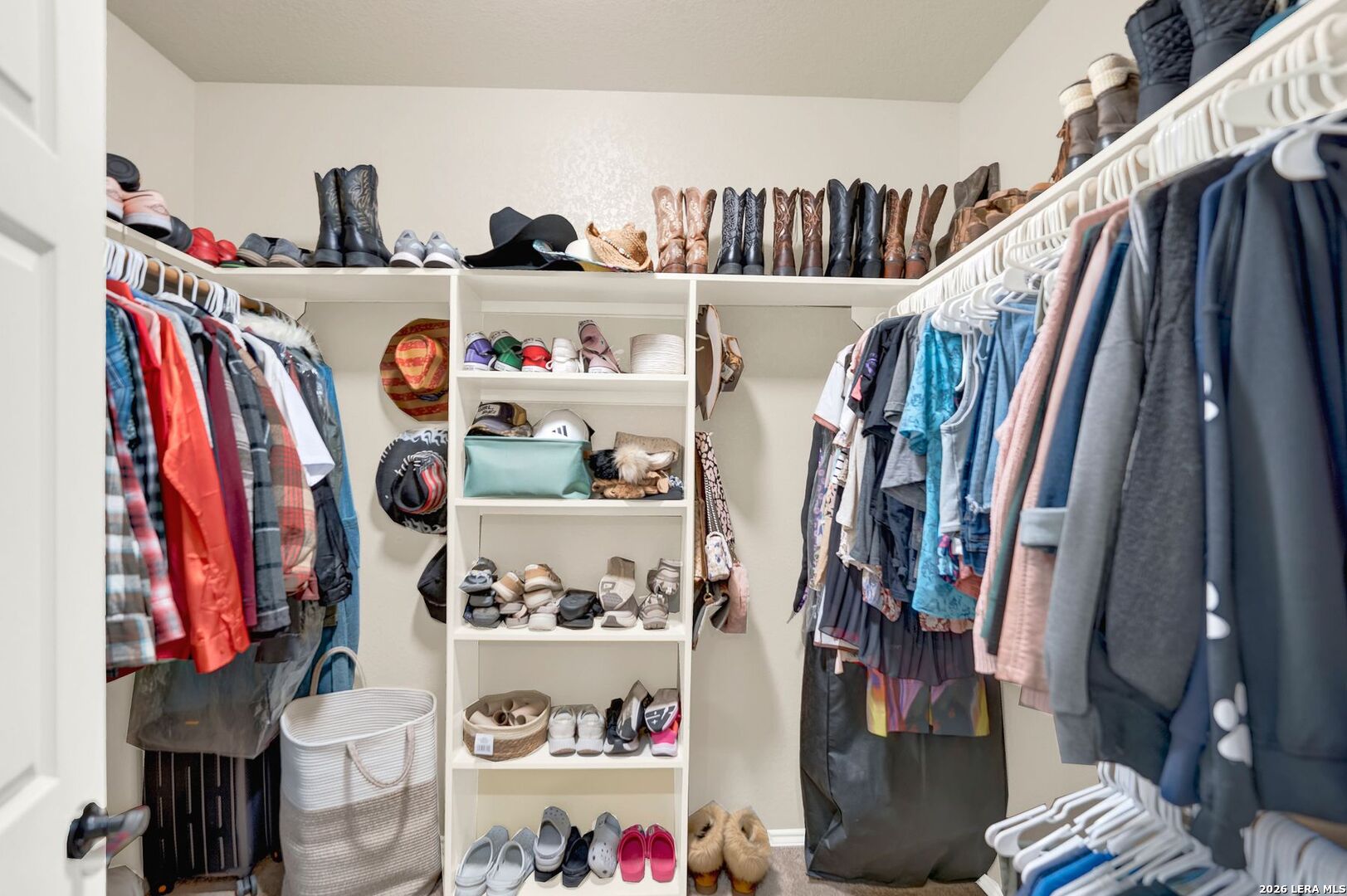 445 Spanish Grant Circle Bandera, TX 78003 - Photo 36 of 47 a view of walk in closet with clothes and shoes