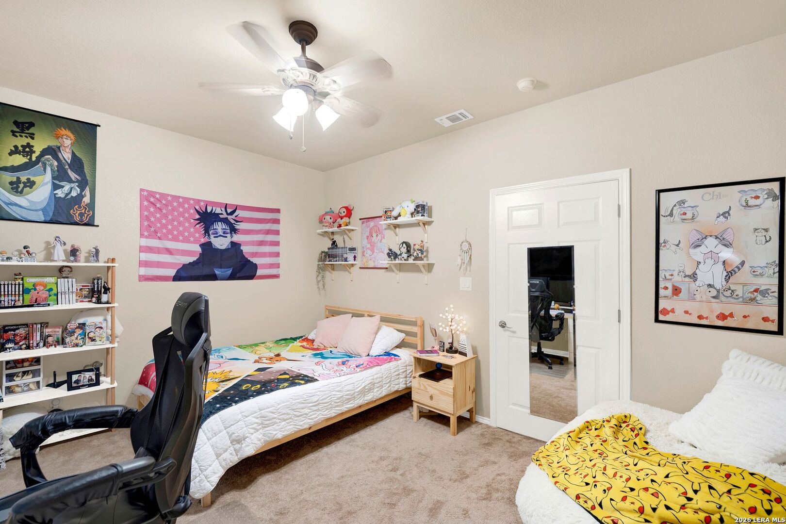 445 Spanish Grant Circle Bandera, TX 78003 - Photo 37 of 47 a bedroom with a bed and a chandelier