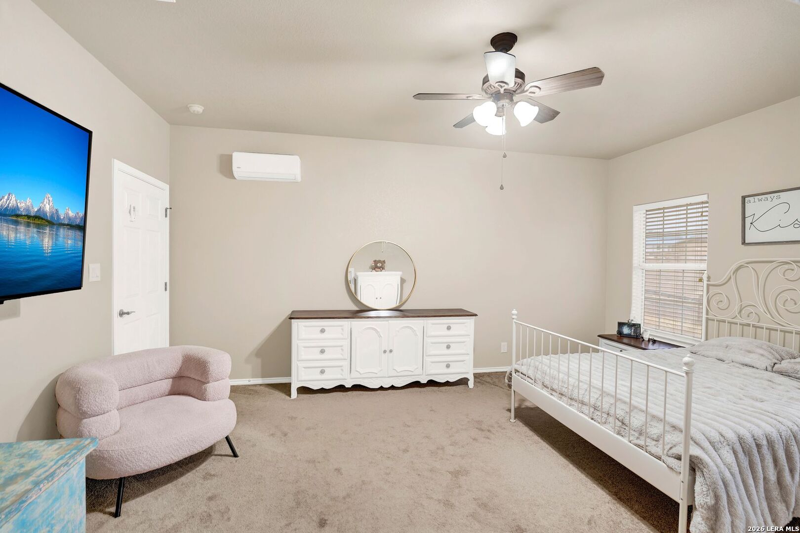 445 Spanish Grant Circle Bandera, TX 78003 - Photo 40 of 47 a bedroom with furniture and a chandelier