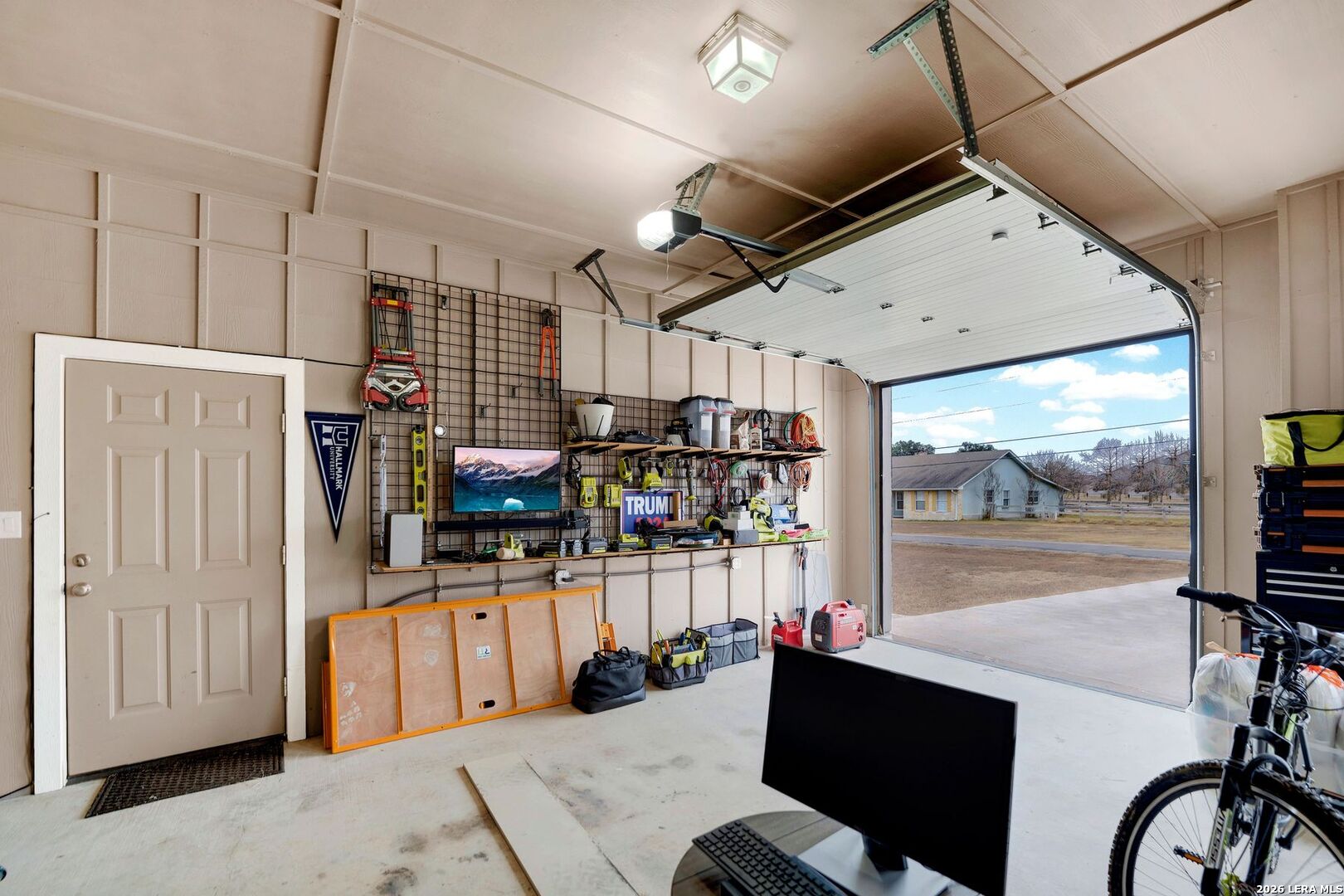 445 Spanish Grant Circle Bandera, TX 78003 - Photo 41 of 47 a room with lots of wooden furniture and a chandelier