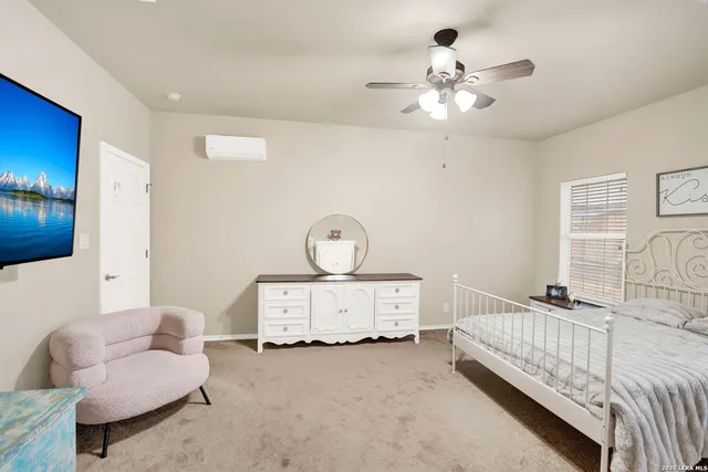 a bedroom with furniture and a chandelier