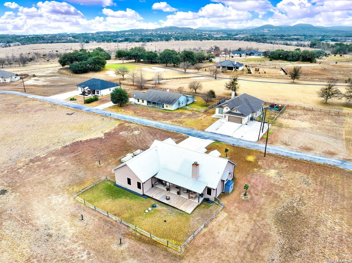 445 Spanish Grant Circle Bandera, TX 78003 - Photo 6 of 47 an aerial view of residential houses with outdoor space