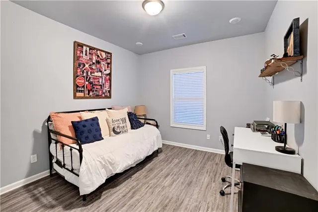 a bedroom with a bed and furniture