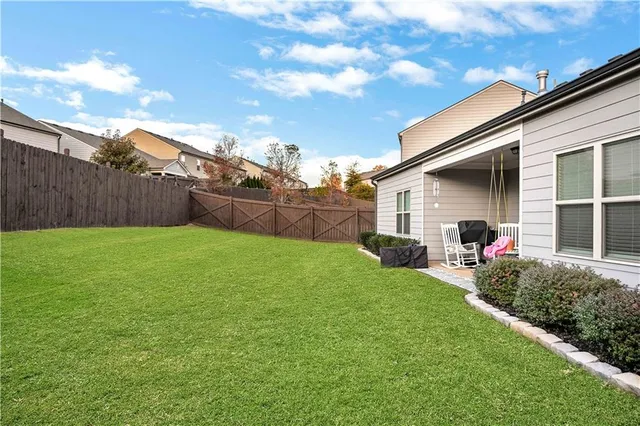 a view of a backyard with a garden and plants