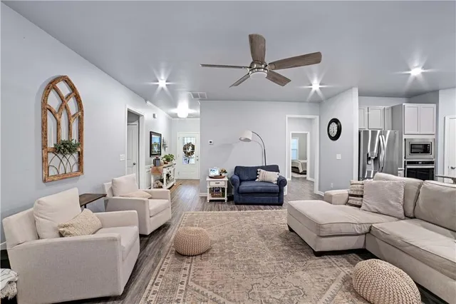 a living room with furniture and a large window