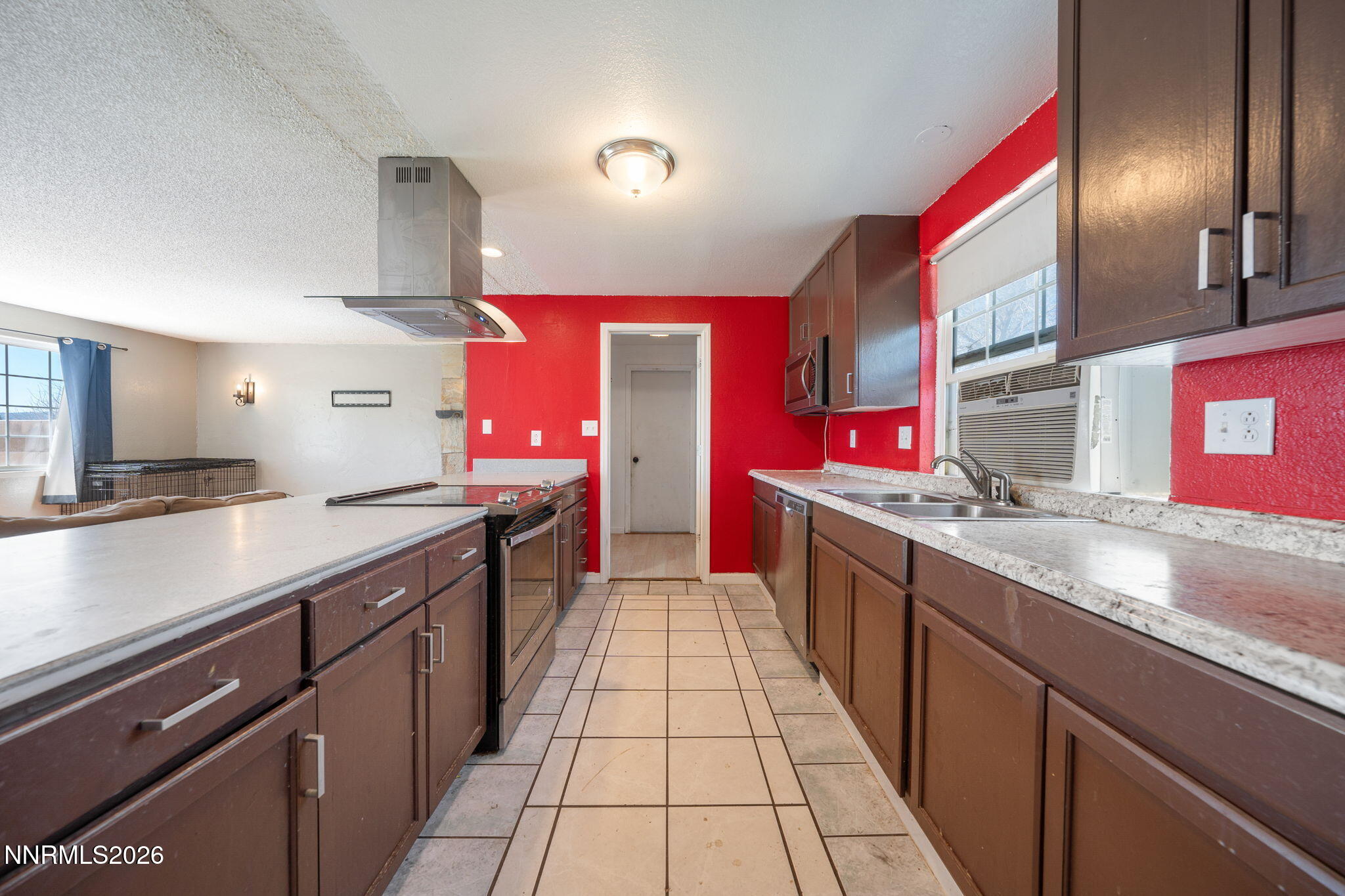 3590 Siskin Lane Reno, NV 89508 - Photo 9 of 31 a kitchen with stainless steel appliances granite countertop a sink and stove