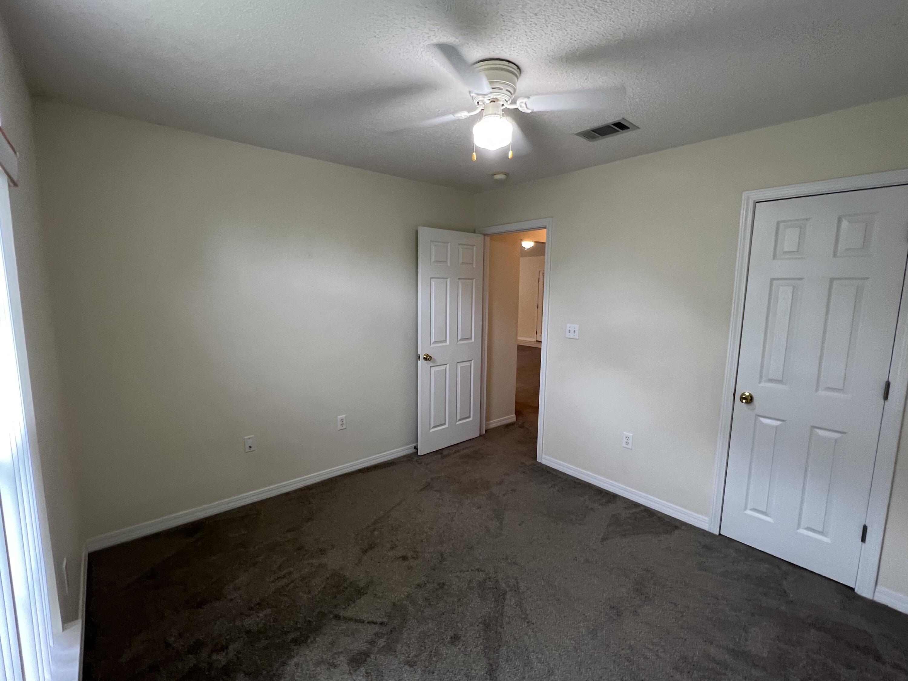 4443 Antioch Road Crestview, FL 32536 - Photo 15 of 24 an empty room with fan