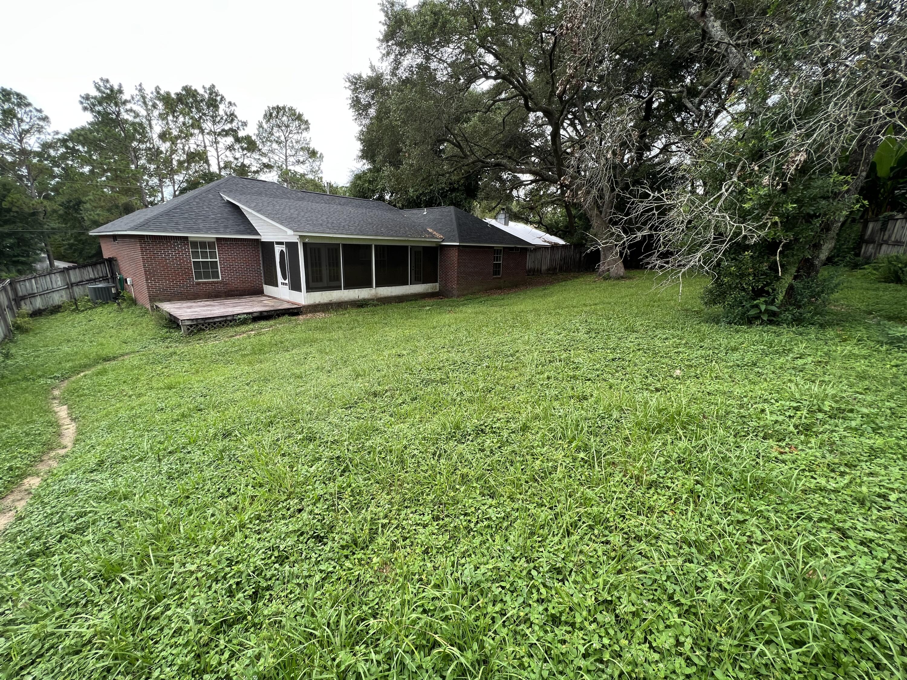 4443 Antioch Road Crestview, FL 32536 - Photo 22 of 24 a front view of a house with garden