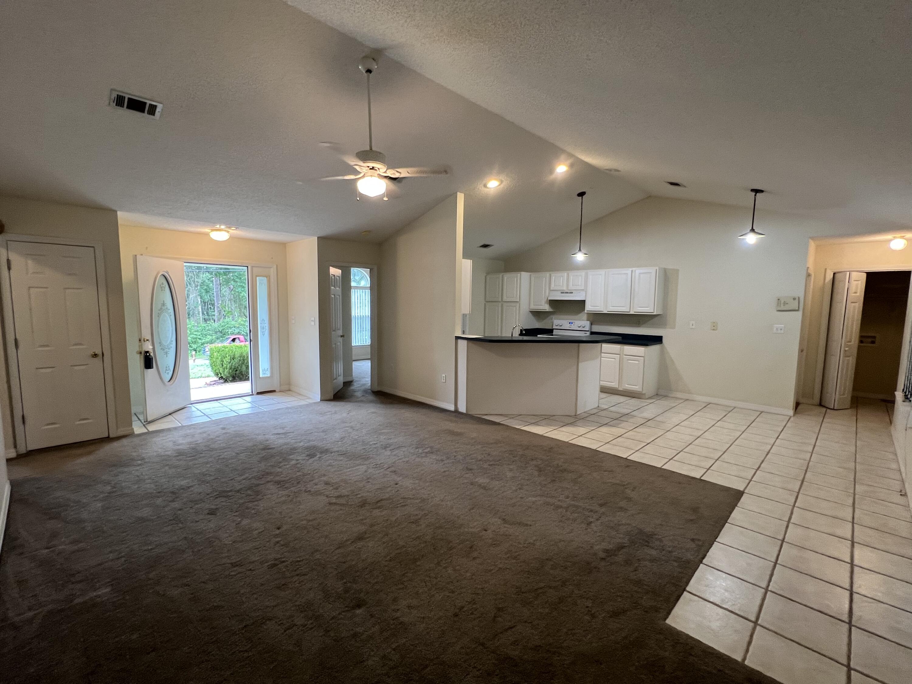 4443 Antioch Road Crestview, FL 32536 - Photo 8 of 24 a view of a kitchen with a sink and a refrigerator