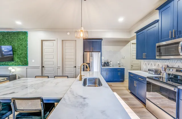 a kitchen with a cabinets and a sink