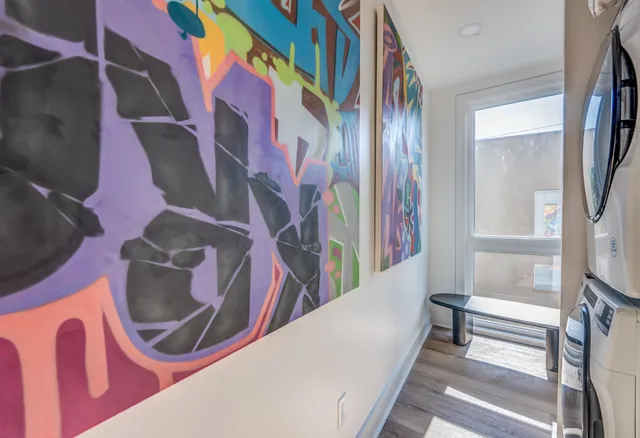 a bathroom with a toilet a sink and a mirror