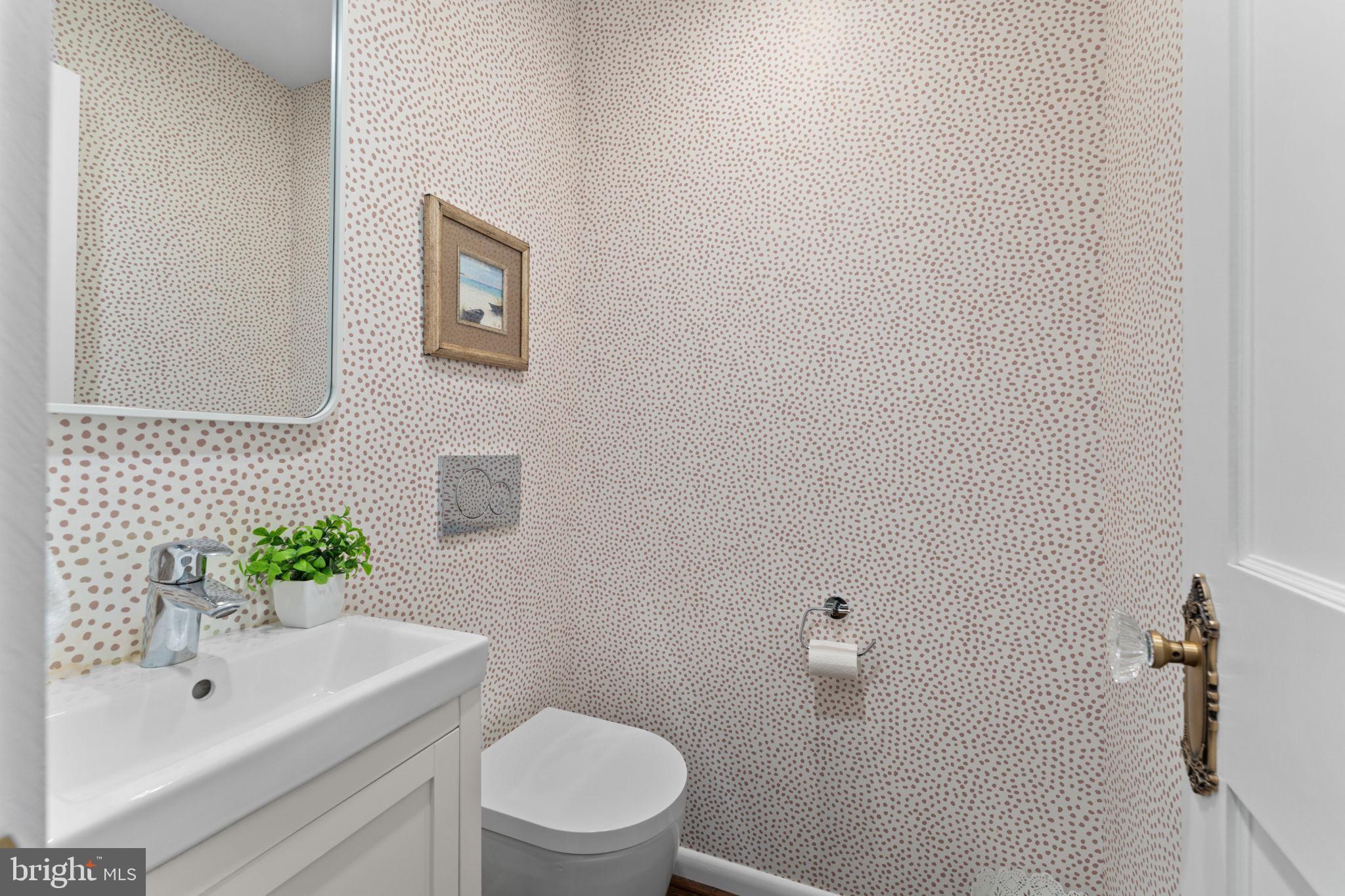 1214 West Braddock Road Alexandria, VA 22302 - Photo 16 of 39 Chic powder room with textured walls.