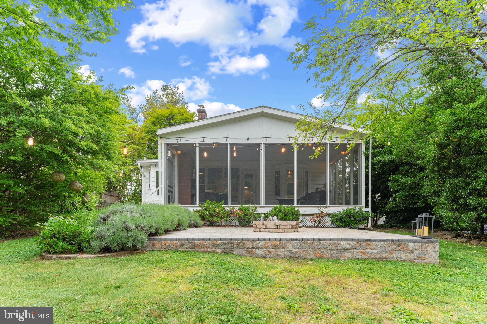 1214 West Braddock Road Alexandria, VA 22302 - Photo 33 of 39 Charming screened porch in lush greenery.