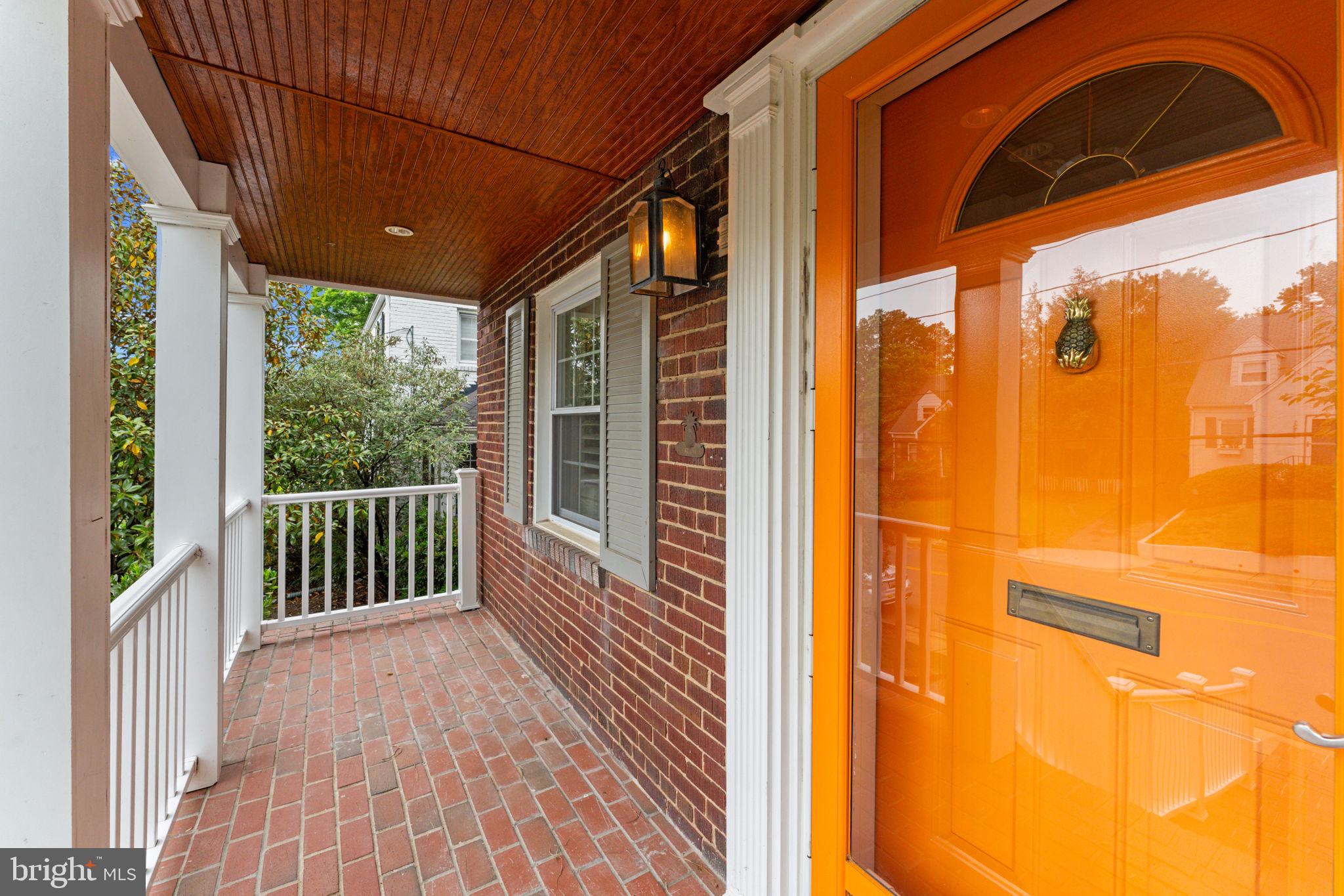 1214 West Braddock Road Alexandria, VA 22302 - Photo 4 of 39 Welcoming entry with vibrant orange door.