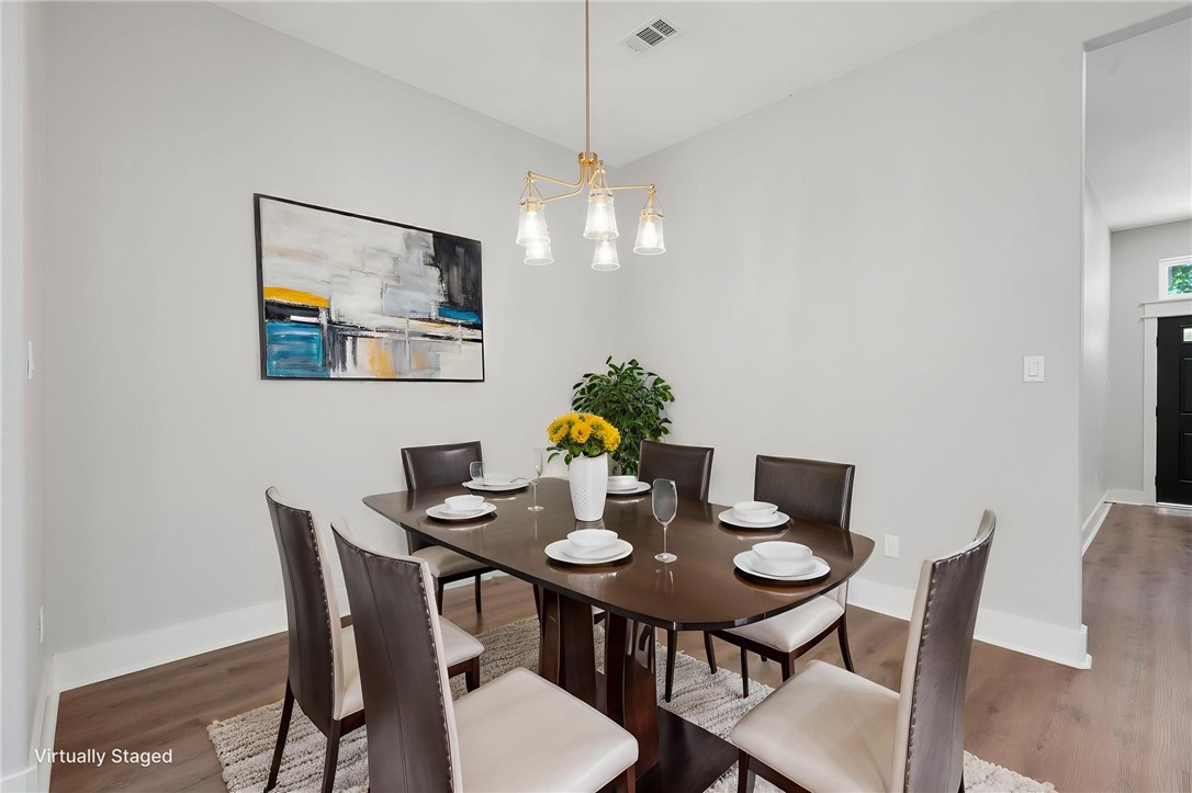 312 Morehead Street Franklin, TX 77856 - Photo 13 of 26 a view of a dining room with furniture and wooden floor