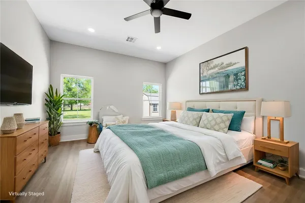 a view of empty room with wooden floor