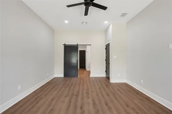 a bathroom with a granite countertop sink double vanity and a mirror