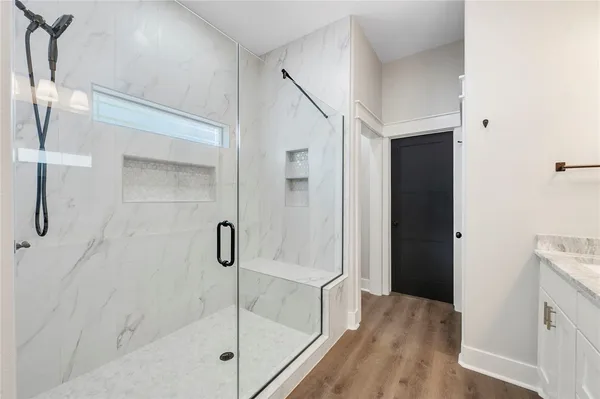 a view of walk in closet with empty racks