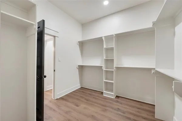 a view of cabinets and wooden floor