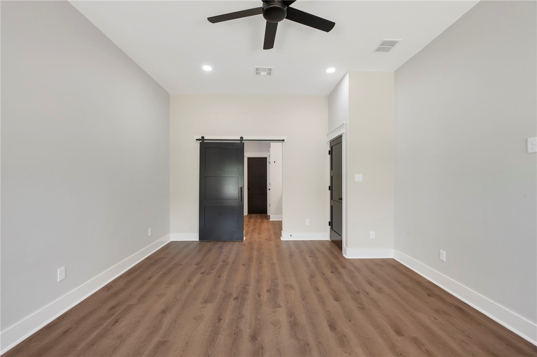 312 Morehead Street Franklin, TX 77856 - Photo 24 of 26 a view of empty room with wooden floor
