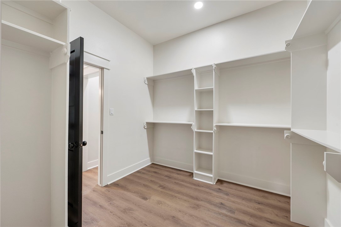 312 Morehead Street Franklin, TX 77856 - Photo 9 of 26 an empty room with wooden floor and closet