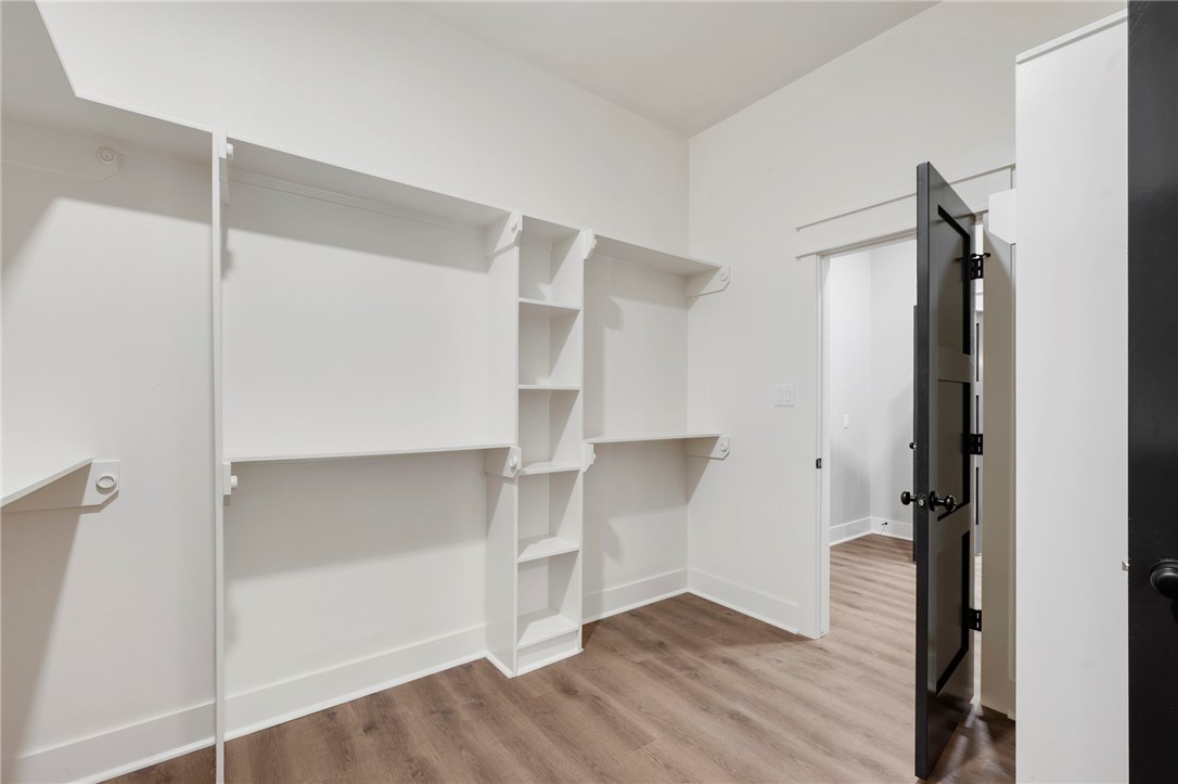 312 Morehead Street Franklin, TX 77856 - Photo 10 of 26 a view of walk in closet with empty racks