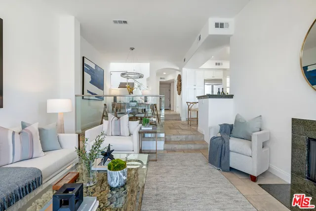a view of a balcony with lake view and a potted plant