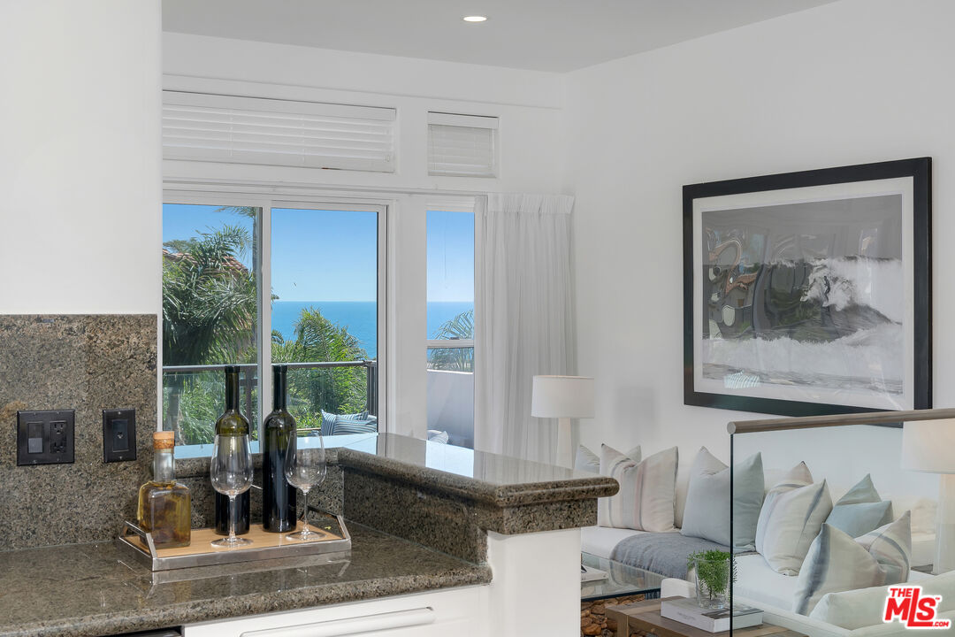 6436 Lunita Road Malibu, CA 90265 - Photo 2 of 54 a living room with furniture and a fireplace