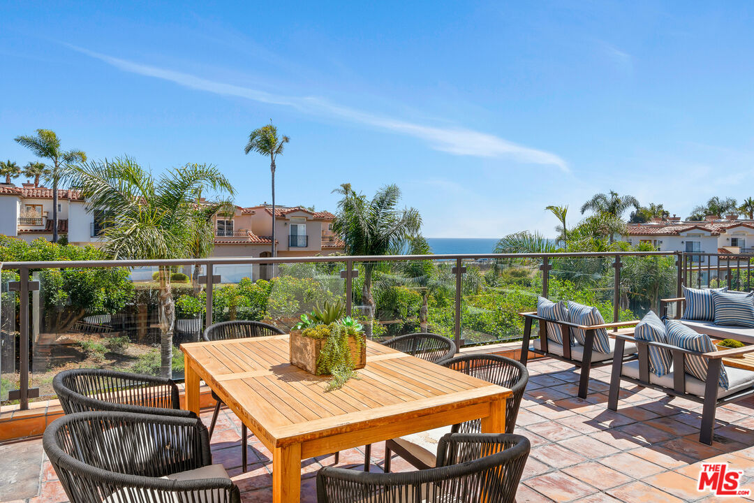 6436 Lunita Road Malibu, CA 90265 - Photo 21 of 54 a view of a chairs and table in the patio