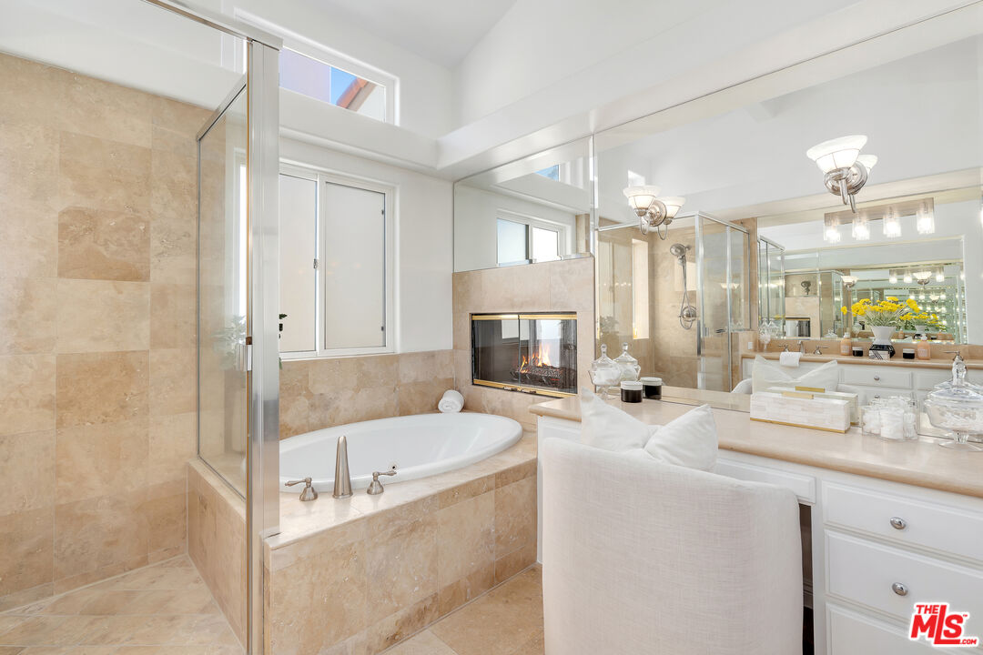 6436 Lunita Road Malibu, CA 90265 - Photo 29 of 54 a bathroom with sink bathtub and mirror