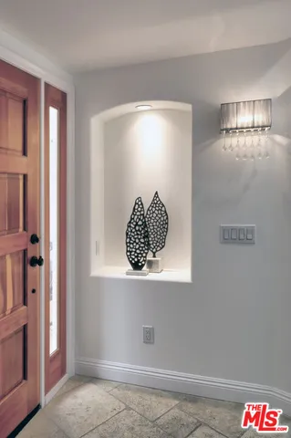 a room with a table and a potted plant