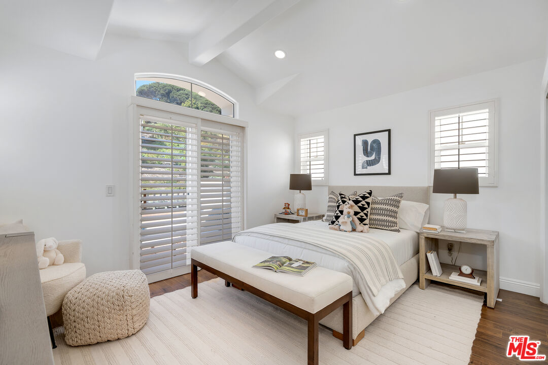 6436 Lunita Road Malibu, CA 90265 - Photo 32 of 54 a bedroom with a bed and a night stand