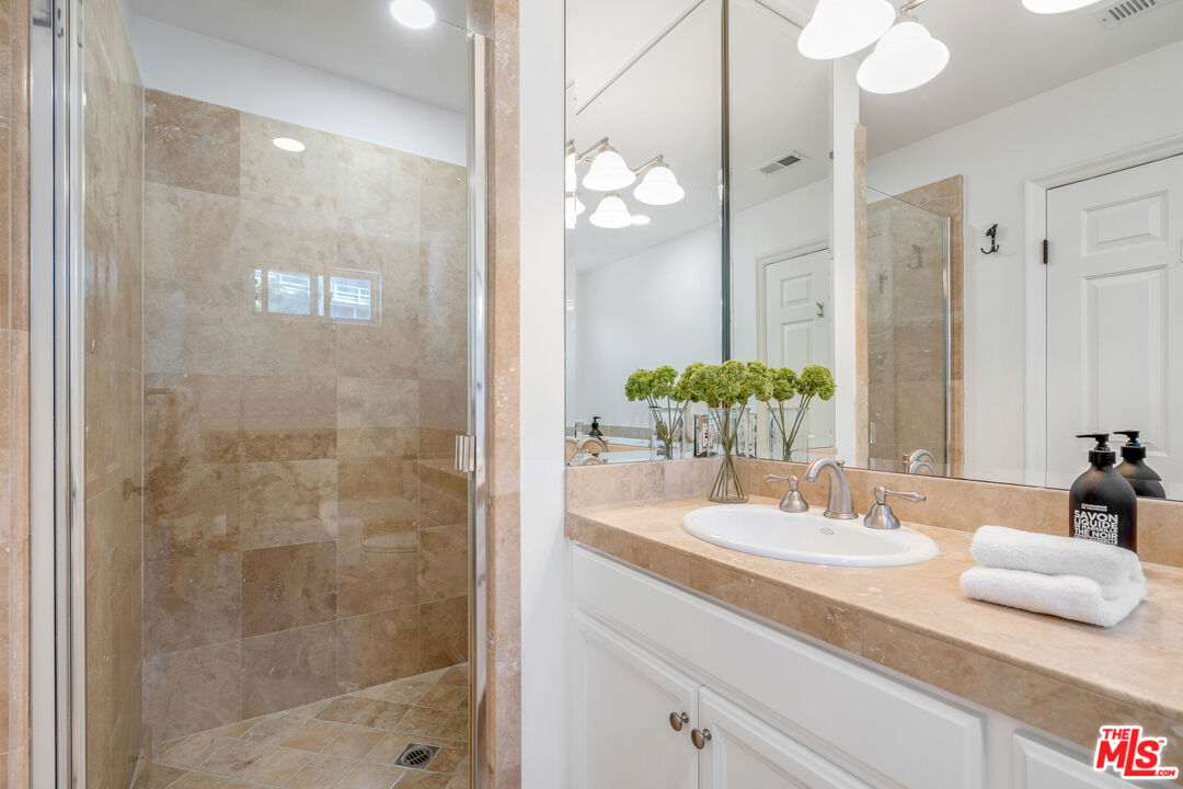 6436 Lunita Road Malibu, CA 90265 - Photo 34 of 54 a bathroom with a sink and a mirror