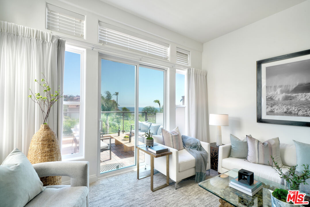 6436 Lunita Road Malibu, CA 90265 - Photo 44 of 54 a living room with furniture and a large window with outer view