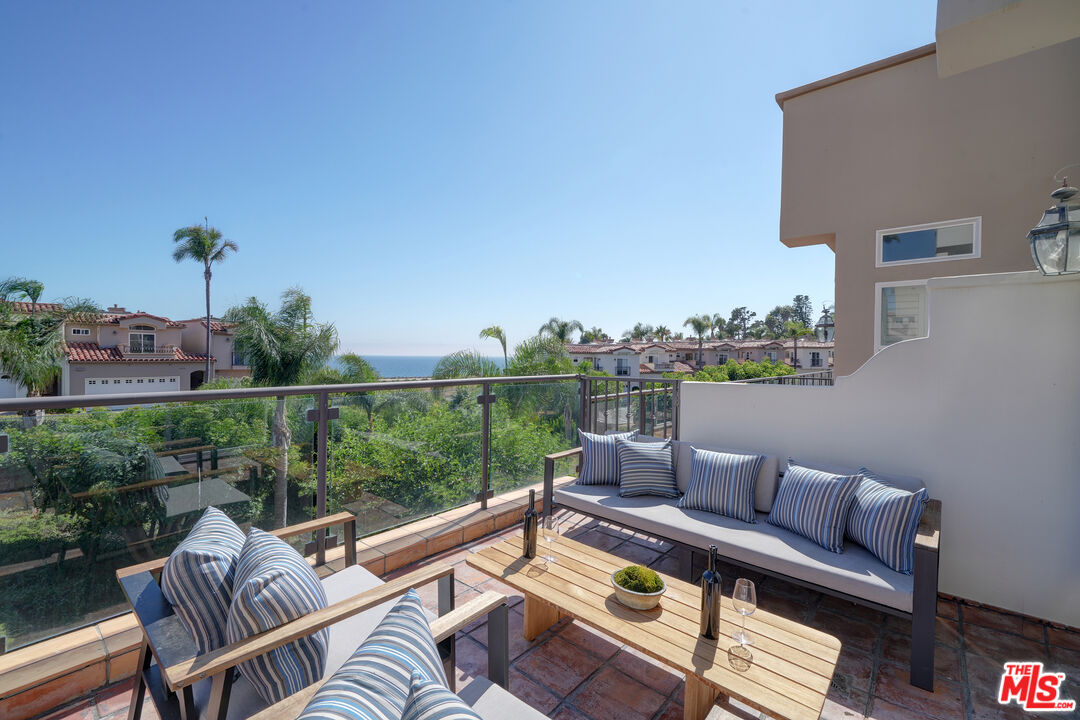 6436 Lunita Road Malibu, CA 90265 - Photo 45 of 54 a view of a balcony with couch