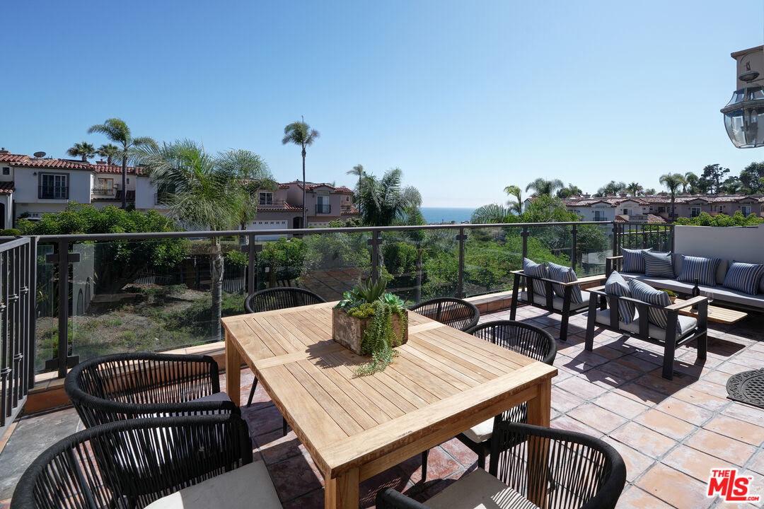 6436 Lunita Road Malibu, CA 90265 - Photo 47 of 54 a view of a dinning table and chairs in the patio