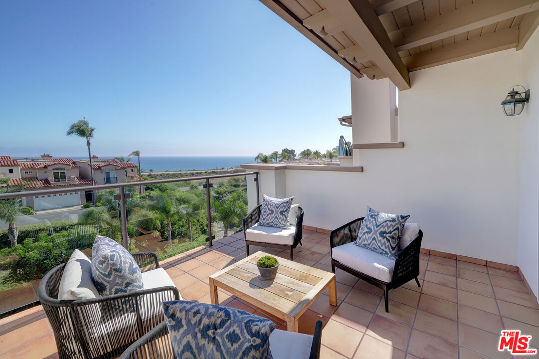 6436 Lunita Road Malibu, CA 90265 - Photo 49 of 54 a balcony with furniture and a potted plant