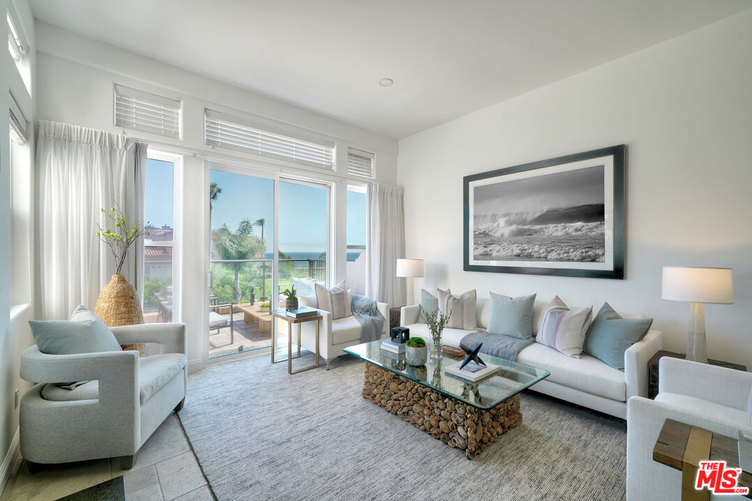 6436 Lunita Road Malibu, CA 90265 - Photo 7 of 54 a living room with furniture and a large window