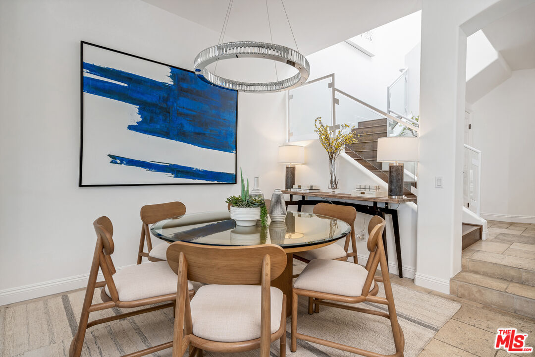 6436 Lunita Road Malibu, CA 90265 - Photo 8 of 54 a dining room with furniture and wooden floor