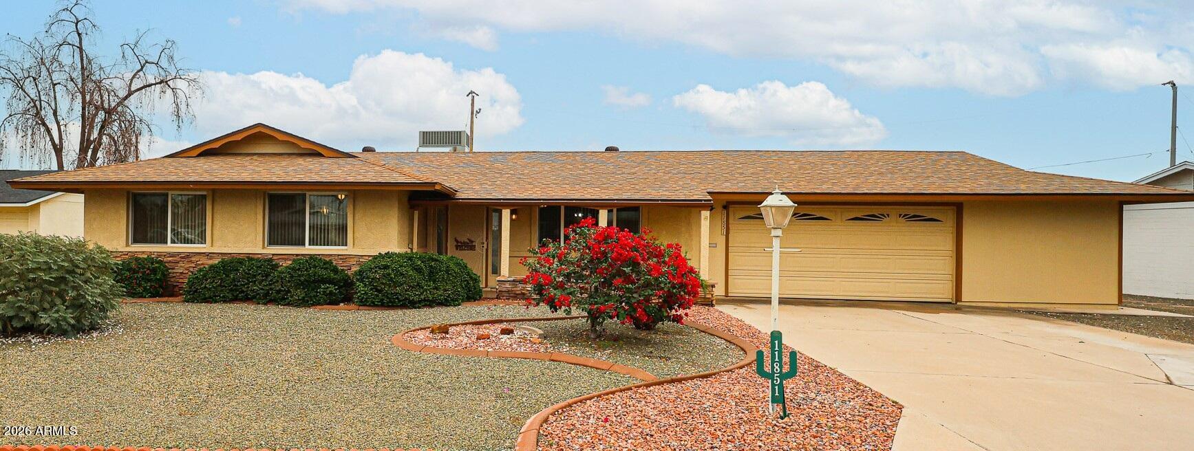 11851 North Thunderbird Road Sun City, AZ 85351 - Photo 46 of 46 a front view of a house with porch