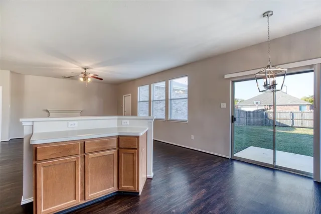 a view of a kitchen with a sink and a window