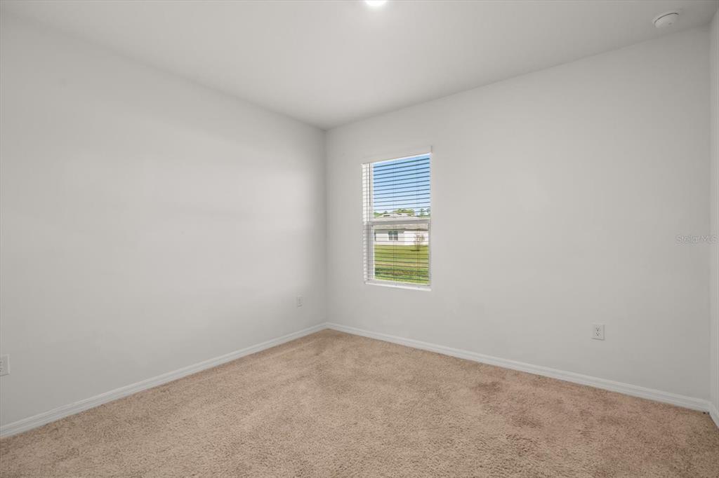 307 Sunset View Drive Edgewater, FL 32141 - Photo 15 of 44 an empty room with a window