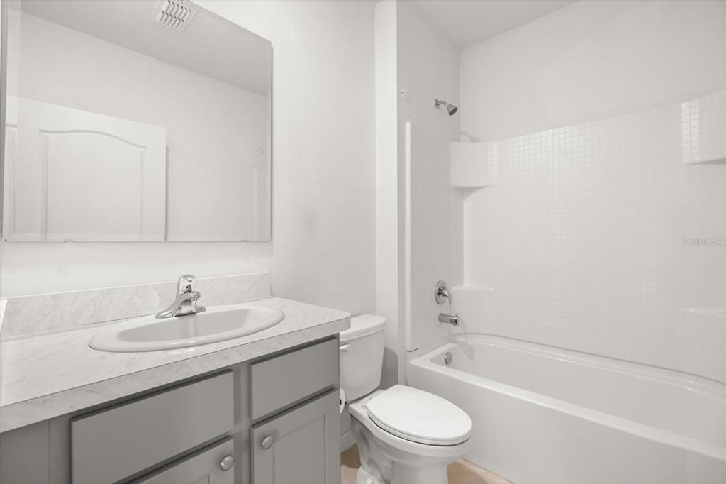 307 Sunset View Drive Edgewater, FL 32141 - Photo 17 of 44 a bathroom with a sink toilet and a bathtub