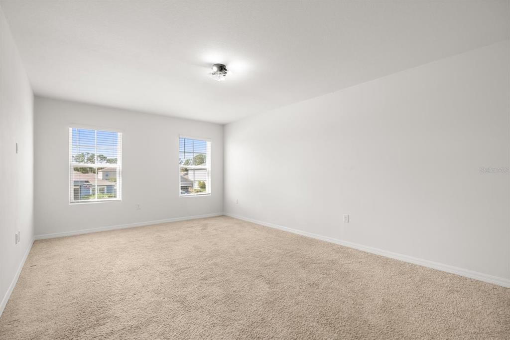 307 Sunset View Drive Edgewater, FL 32141 - Photo 18 of 44 an empty room with windows