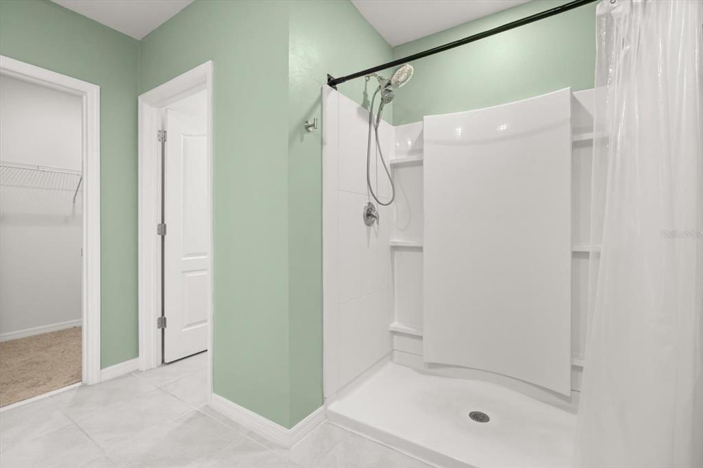 307 Sunset View Drive Edgewater, FL 32141 - Photo 21 of 44 a bathroom with a shower and a tub