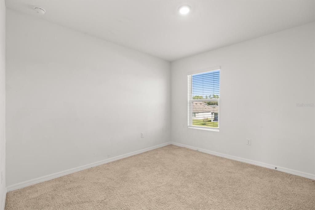 307 Sunset View Drive Edgewater, FL 32141 - Photo 24 of 44 a view of an empty room with a window