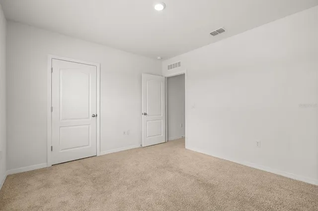 a view of house with outdoor space and swimming pool