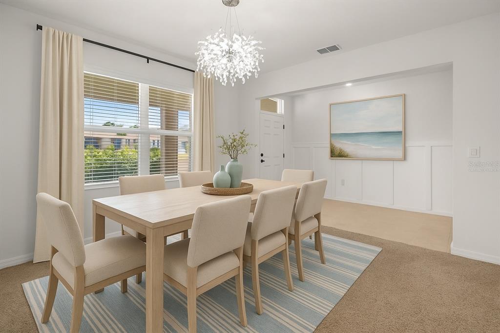 307 Sunset View Drive Edgewater, FL 32141 - Photo 5 of 44 a view of a dining room with furniture a chandelier and wooden floor
