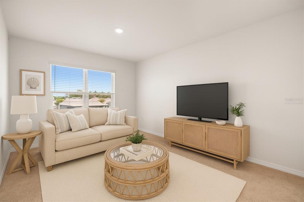 307 Sunset View Drive Edgewater, FL 32141 - Photo 8 of 44 a living room with furniture and a flat screen tv